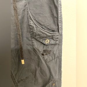 NIKE Cargo Activewear Wide-leg Mid-rise Pants in Black